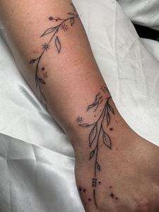 Botanical vine wrapping the wrist