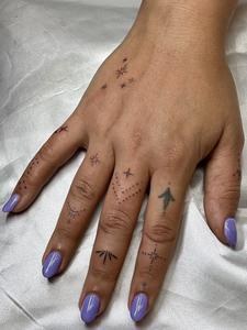 Micro finger tattoos — sparkles and symbols