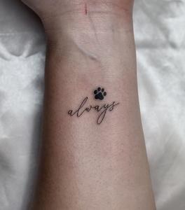 Script tattoo — always, with a paw print